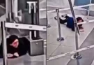 Shocking moment woman crawls under airport security barrier before sneaking onto plane unnoticed