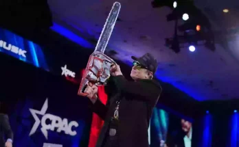 Elon Musk waves ‘chainsaw for bureaucracy’ on stage in bizarre CPAC appearance