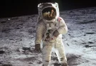 Artist enhanced reflection of Buzz Aldrin's helmet in famous moon photo and pointed towards one detail