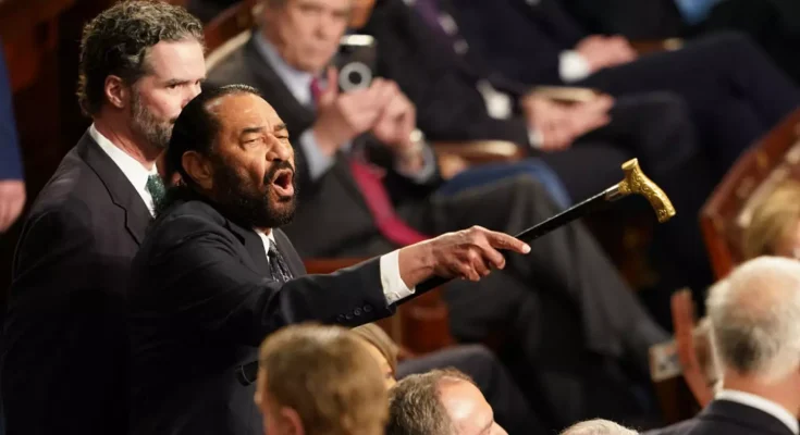 What lawmaker said before heckling caused him to be thrown out from Trump's speech to Congress