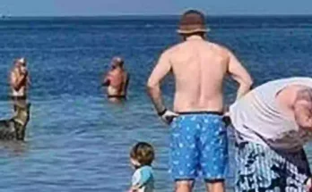 Family left horrified after spotting scary detail in background of beach photo